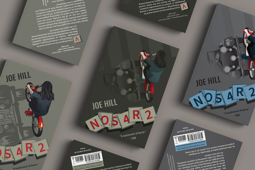 Three book cover designs lay diagonally.